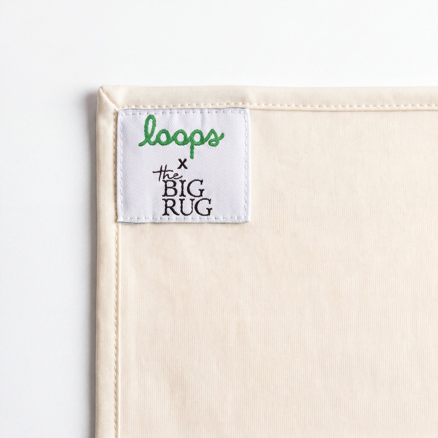 The Loops x The Big Rug woven label